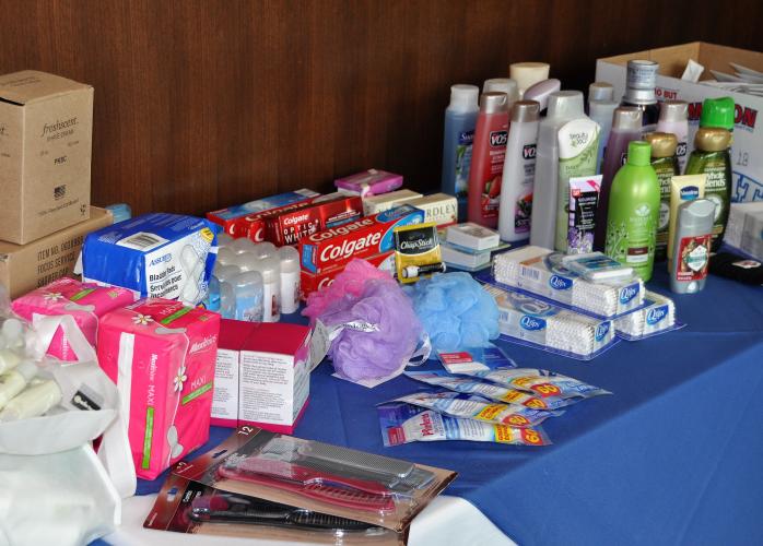 Table filled with toiletries as donations to Wellspring