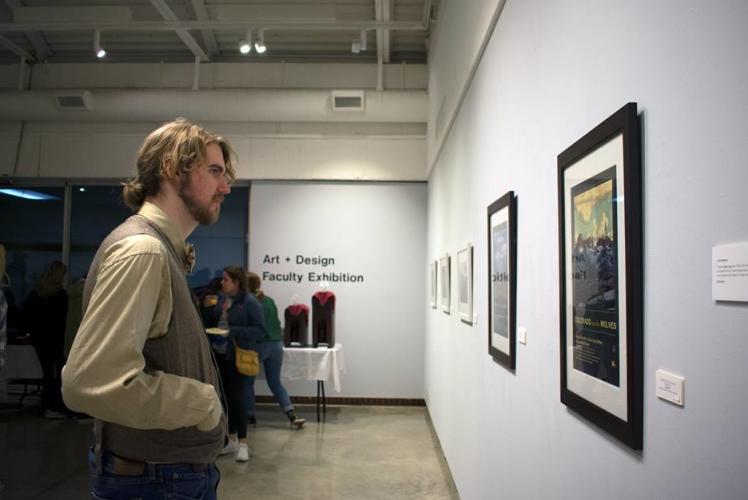 UW- Eau Claire Foster Art Gallary: man looking at art