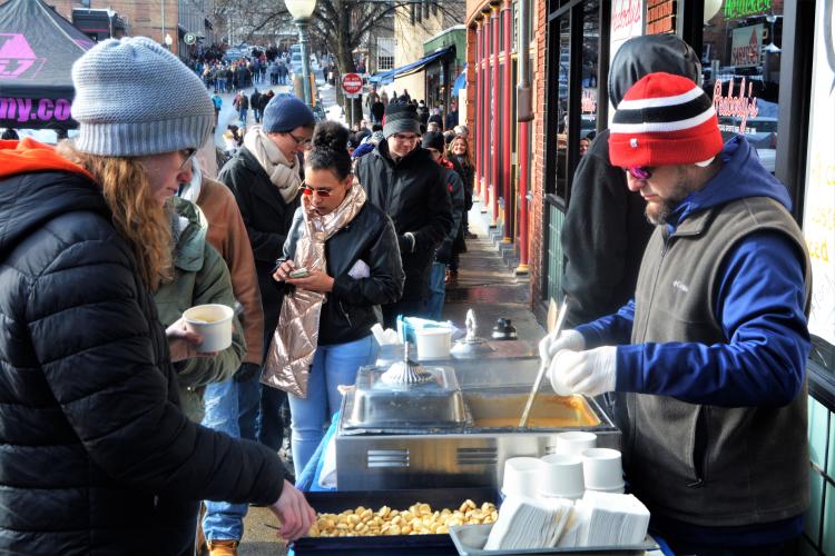 Peabody's serving chowder to a line of Chowderfest attendees