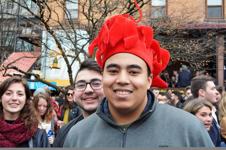 Guy wearing a red lobster hat