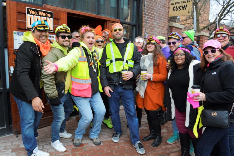 People dressed in neon clothing posing