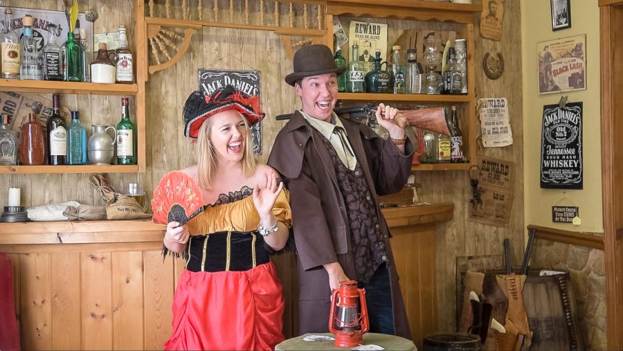 A couple in antique garb plays it up for the camera at Old Timey Photos in Chimney Rock Village.