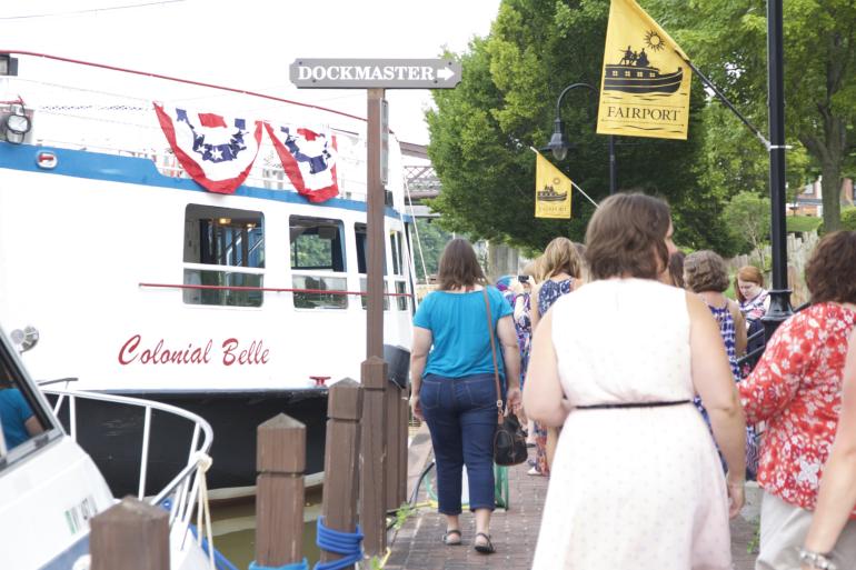 Meeting attendees prepare to board Colonial Belle tour boat