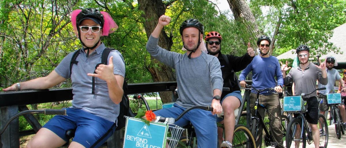 Several men on their bikes with helmets on the Beyond Boulder Adventures