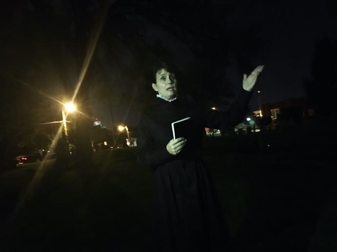 Tour guide in costume for the UnSeen BG Walking Tour at night