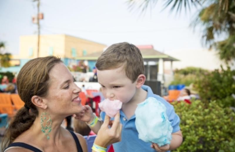 Mom feeding kid cotton candy at the Carolina Beach Boardwalk