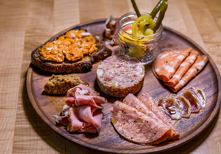 A charcuterie board of meats and pickles from Under the Oak Cafe in Smithfield