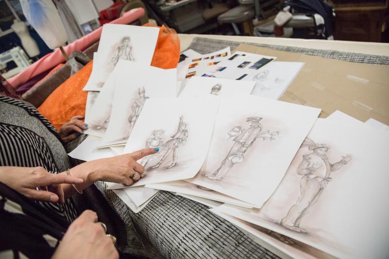 Costume designer Helene Siebrits and her team look over sketches for Tantrum Theater’s production of A Midsummer Night’s Dream