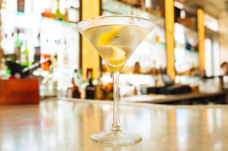 A twist of lemon dances in a martini glass at Twist Martini & Associates at Virginia Beach Town Center