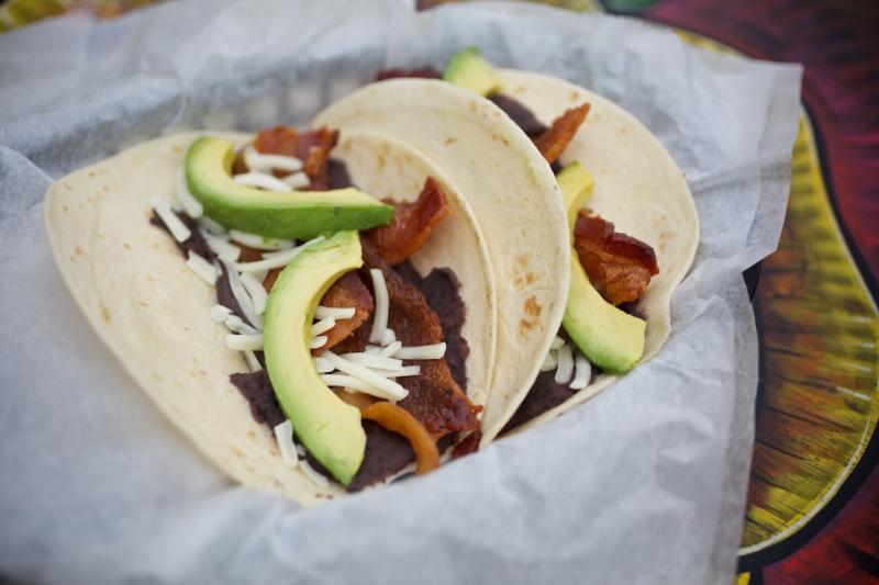 The Otto breakfast taco with bacon cheese avocado and beans from Tacodeli in austin texas