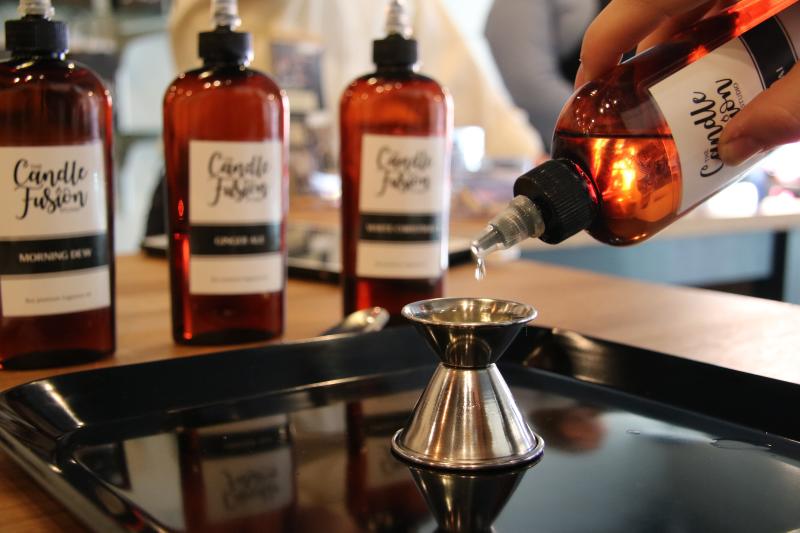 Candle Fusion scents being poured into jigger