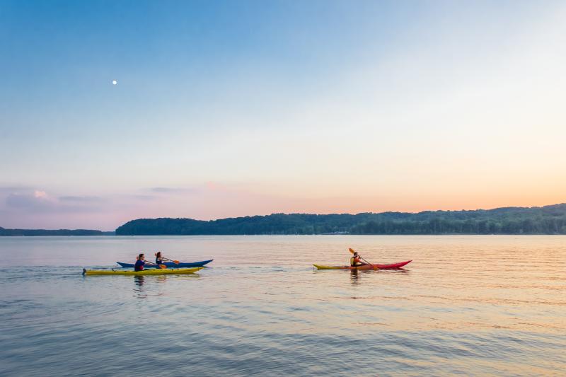 Group of people kayaking on Monroe Lake in Bloomington Indiana