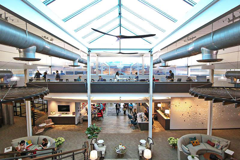 The interior of Versa features modern workspaces with an open and industrial design.