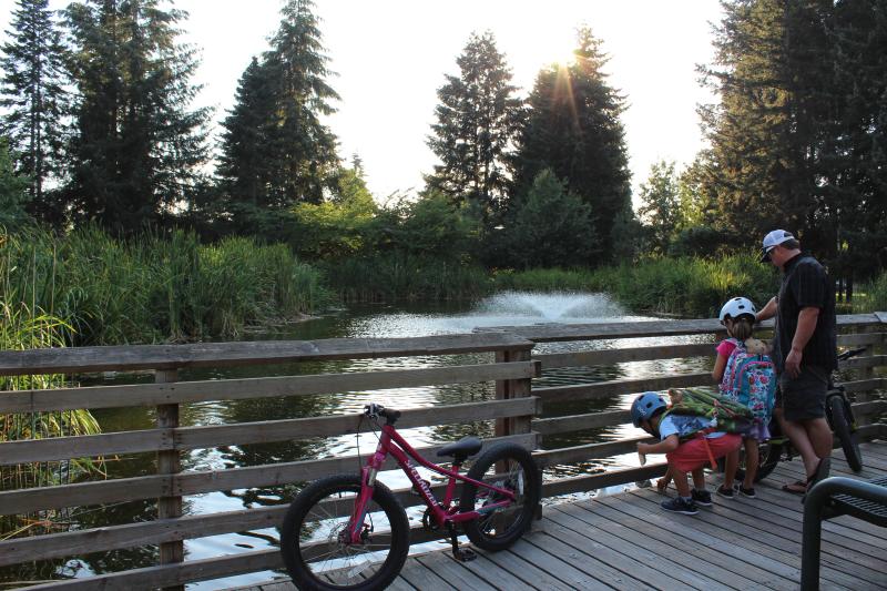 A group pauses on their bike ride through Cochrane Memorial Park to enjoy the scenery.