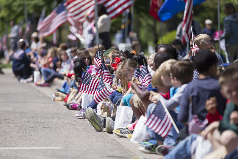 Memorial Day parade kids waving flags