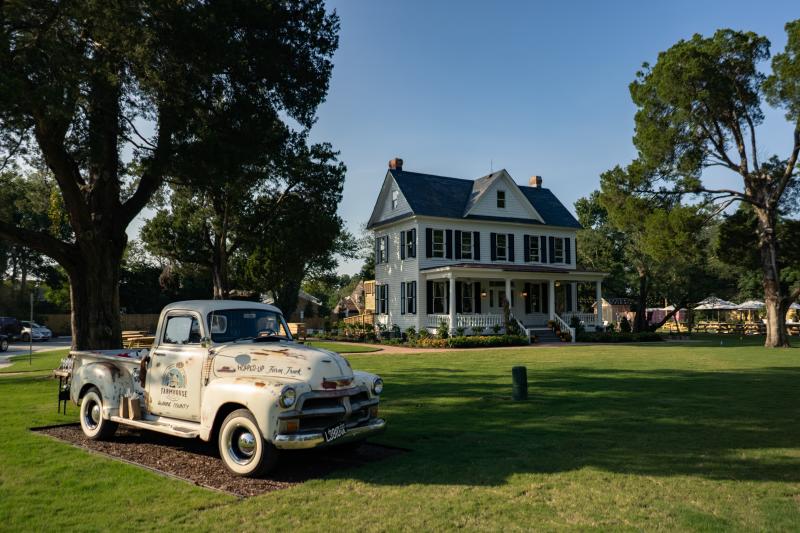 An old truck decorates the lawn at Back Bay's Farm House Brewery.