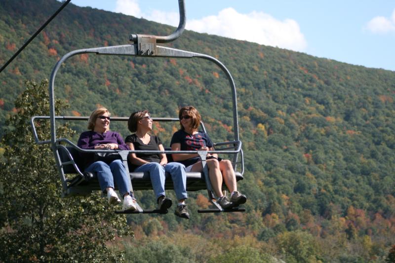 finger-lakes-bristol-mountain-canandaigua-fall-sky-ride-three-women-in-chair