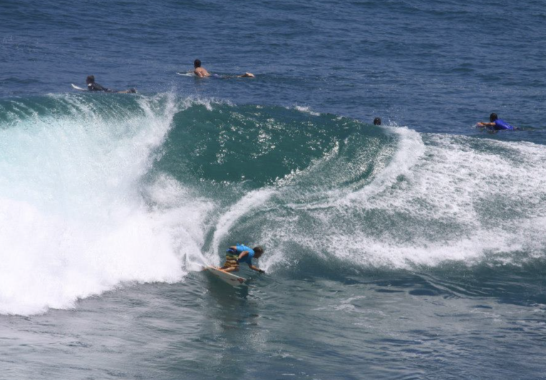 group surfing in water