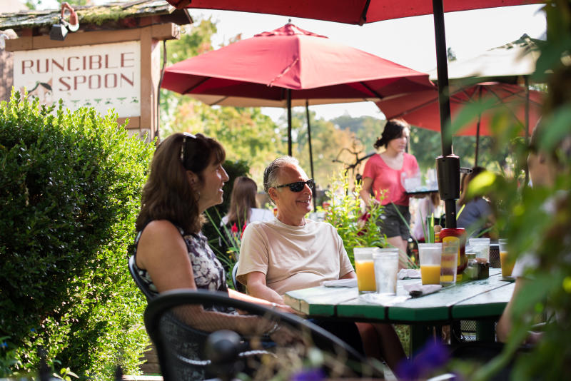 People sitting on patio at Runcible Spoon in Bloomington