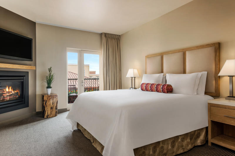 Inn at the 5th courtesy of Obie Companies A luxury room with balcony and fireplace at the Inn at the 5th in Eugene.
