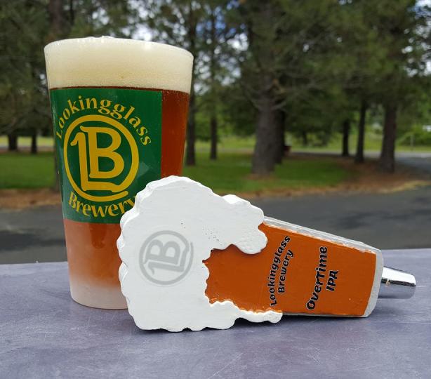 Pint of beer and beer tap handle