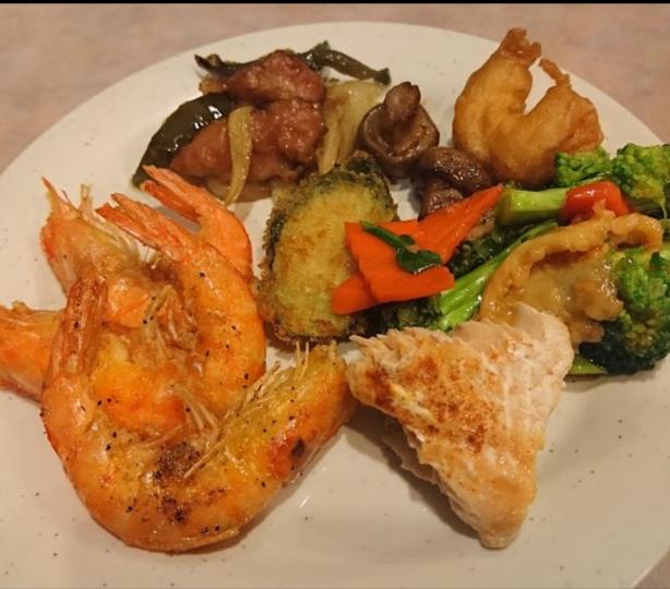 Plate full of steamed vegetables and shrimp