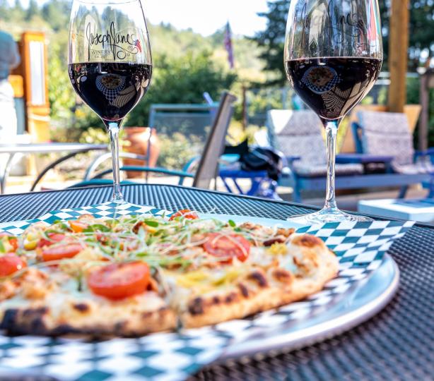 two wine glasses and specialty pizza.jpg
