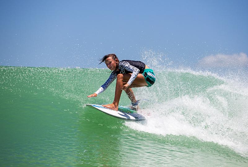 Kid surfs at NLand Surf Park.