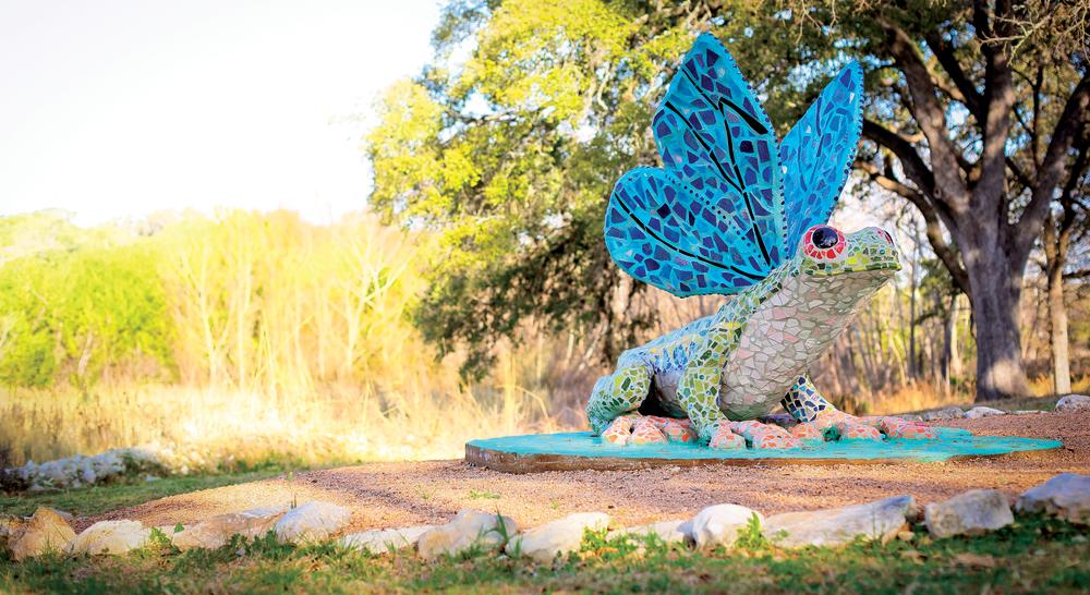 Frog sculpture in garden at Bee Cave Sculpture Park