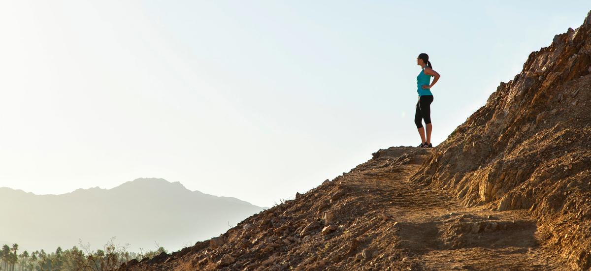 Hiker standing on a mountainside trail near Palm Springs