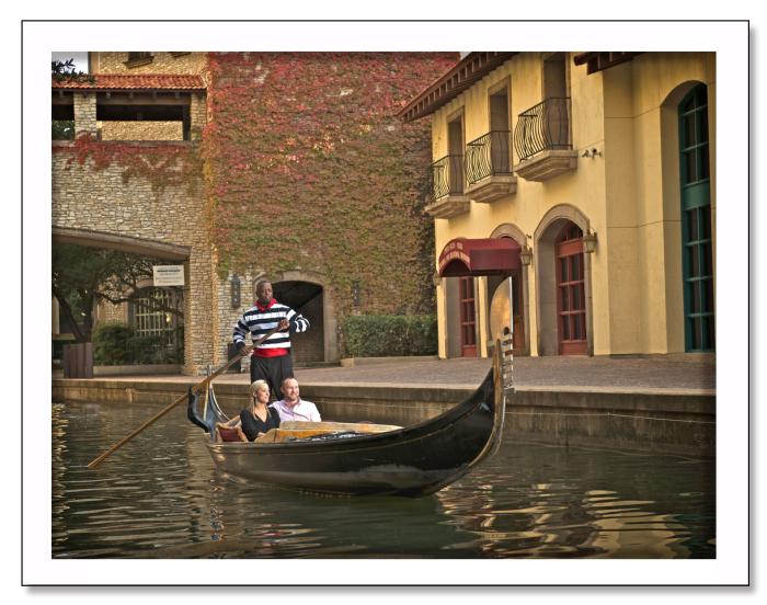 Visitors enjoy a gondola ride down a Mandalay Canal waterway.