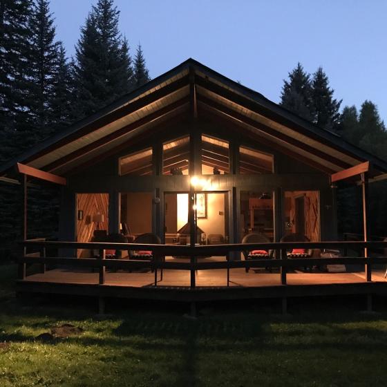 Creekside vacation home at night