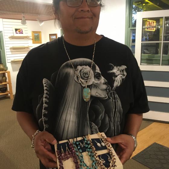 Travis displaying his work