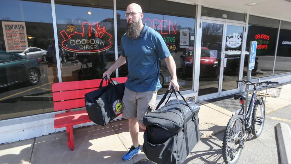 Man with a beard providing Wichita2go Food Delivery service