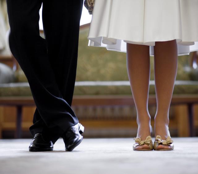 Feet of the Bride and Groom in Shoes