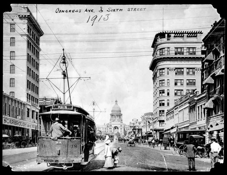 looking north on Congress Avenue at Sixth Street in 1913 with trolley car in front