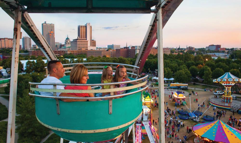Family in Ferris Wheel at Three River Festival