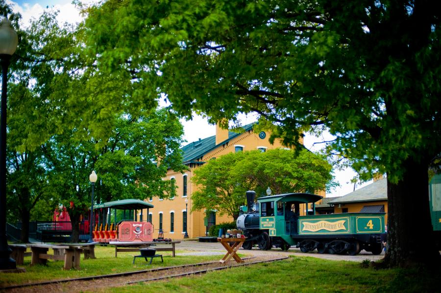 An antique railcar sits quietly at the historic Huntsville Depot.