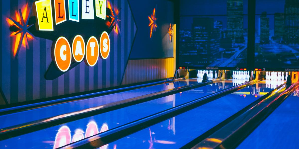Photo of Alley Cats Entertainment bowling lanes and sign with black light