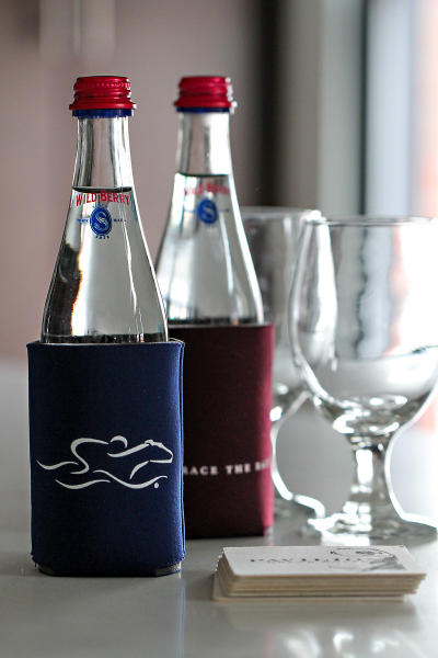 EMBRACE THE RACE koozies with sparkling Saratoga Water