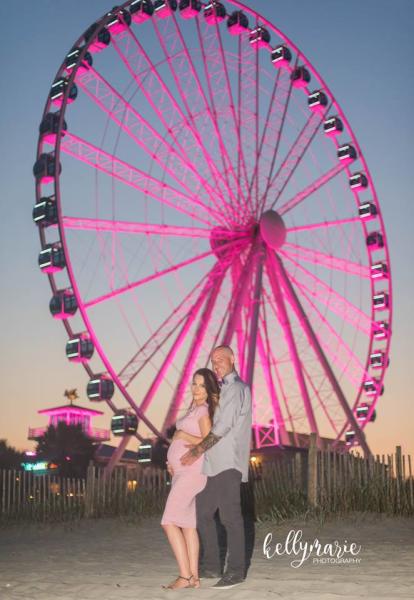 Gender Reveal with Couple in front of Pink Skywheel