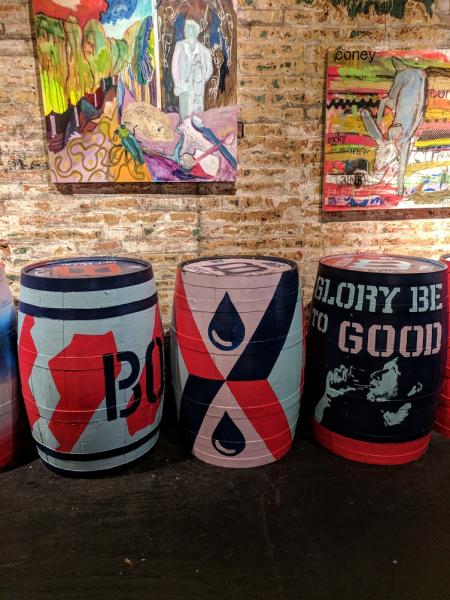 Three art painted bourbon barrels feature artwork for The B-Line in Northern Kentucky