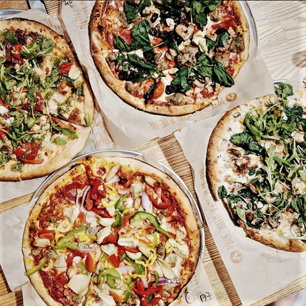 Four different made-to-order pizzas at Blaze Fast Fire'd Pizza.