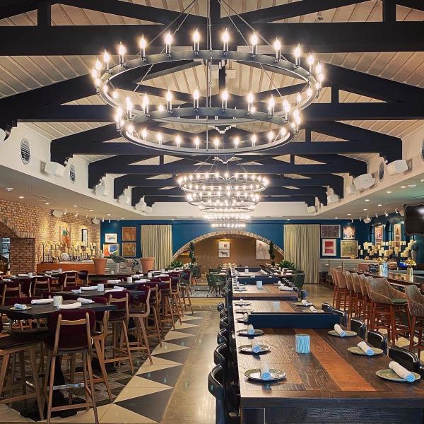 Wood beams and oversized light fixtures give the Mexican Sugar dining area a rustic charm.