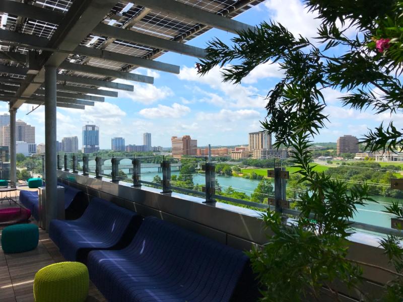 Austin Central Library Rooftop reading spaces with view of Lady Bird Lake during summer
