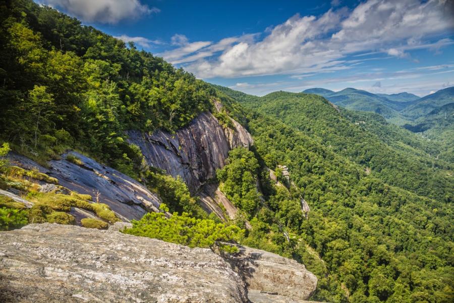 View of the rock faces and forest along Skyline Trail in Chimney Rock State Park.