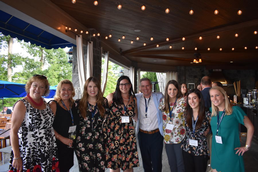Medium sized group smiling at Saratoga National Golf Club networking event