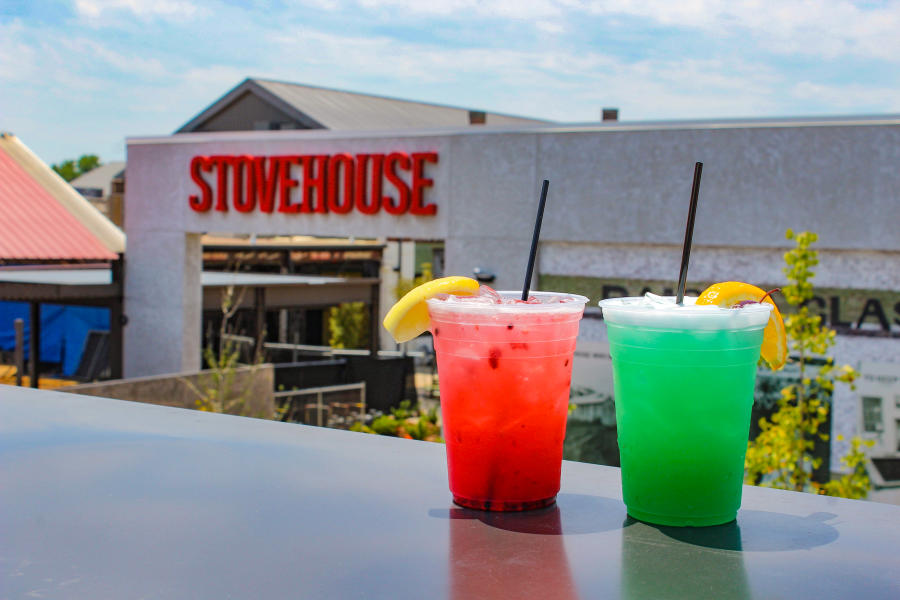 Fresh cocktails sit on an outdoor table at Pourhouse in Huntsville.