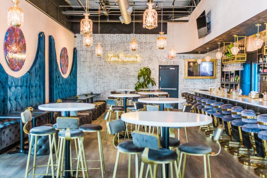 Plush blue velvet and crystal lights decorate the dining area at Tom Brown's Restaurant in Huntsville.