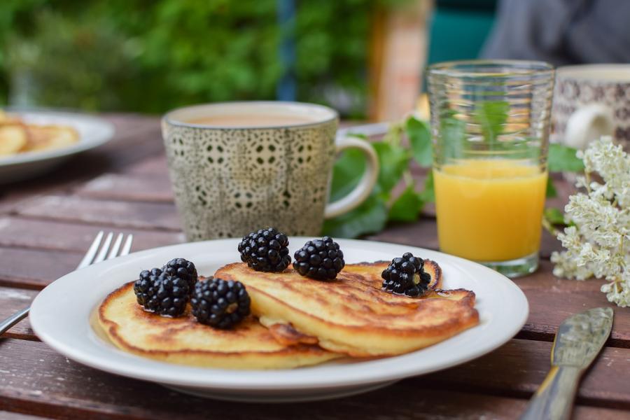 pancakes topped with blackberries